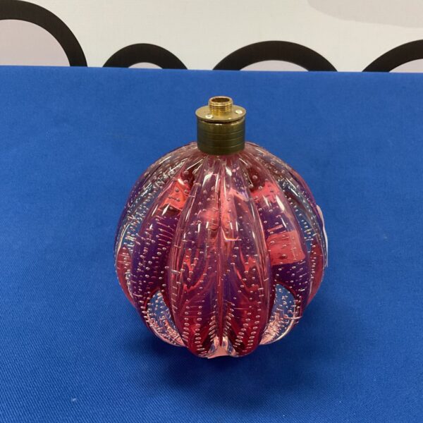 Vintage cranberry glass table lamp base with bubble texture.