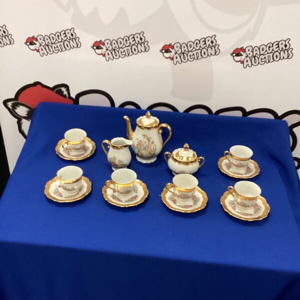 Vintage Czechoslovakian bone china coffee set with gold accents.