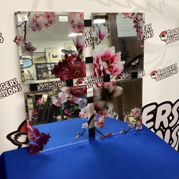 Vintage floral wall mirror with detailed sculpted flowers.