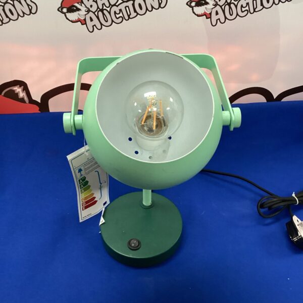 Vintage green desk lamp with adjustable shade and weighted base.