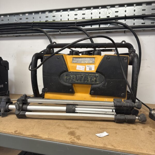 Dewalt DCR015 site radio mounted on a camera tripod.