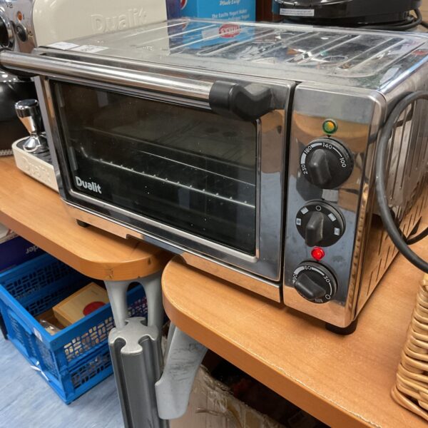 Stainless steel Dualit mini oven, a compact kitchen appliance.