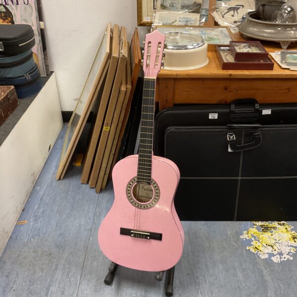 Vintage Falcon pink acoustic guitar in present condition.