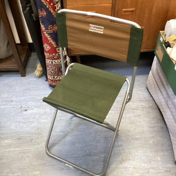 Vintage Shakespeare fishing chair with green canvas seat.
