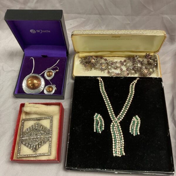Vintage jewellery lot with four boxes and assorted pieces.