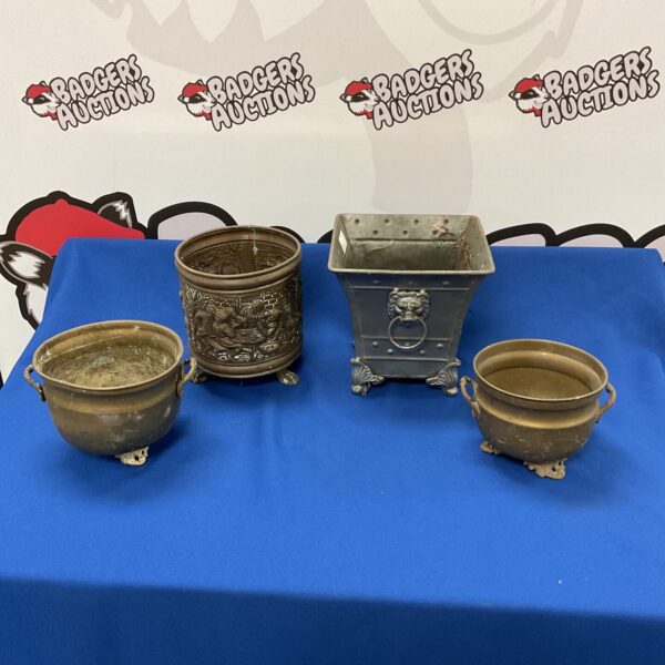 Set of four vintage copper and brass planters for garden or indoor use.