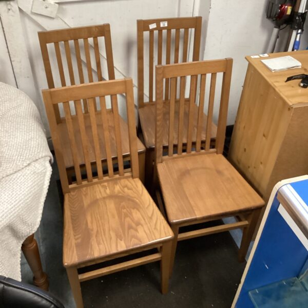 Set of four vintage wooden dining chairs for kitchen or dining room.