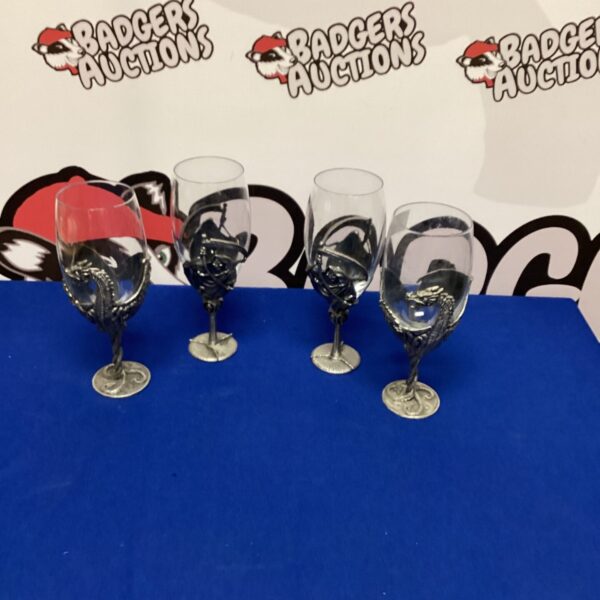 Set of four vintage Gothic wine glasses with black stems.