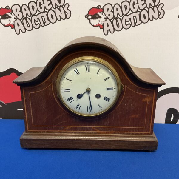 Antique French mantle clock with white enamel dial.
