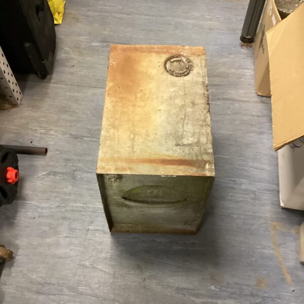 Side view of a vintage galvanised water tank with rust.