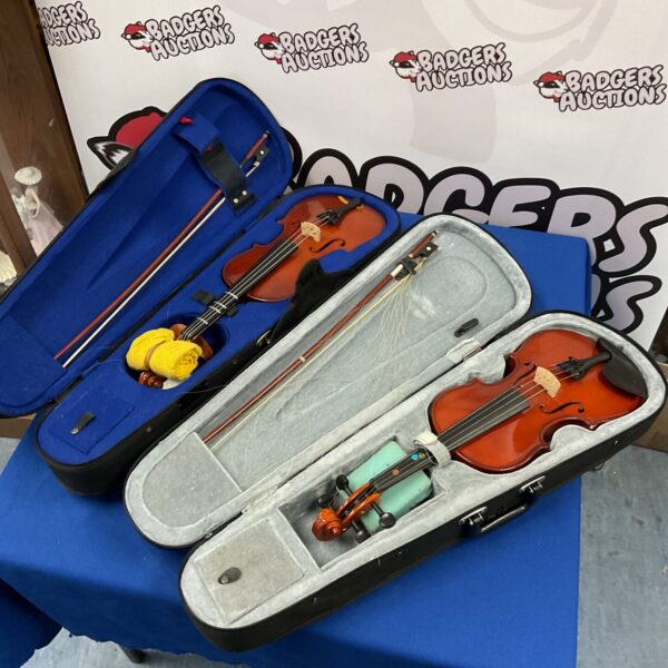 Two violins with cases and bows, including Gear 4 and Stentor models.
