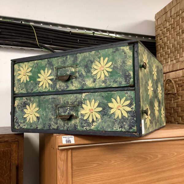 Vintage hand-painted wooden drawers with colourful floral pattern.