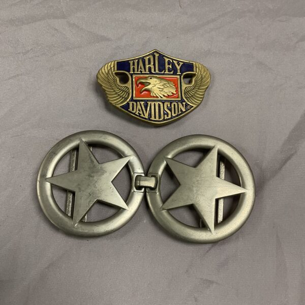 Group of vintage Harley Davidson and Texas lone star belt buckles.