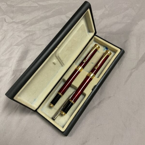 Hauser Germany fountain pen and ballpoint pen set in red and gold.