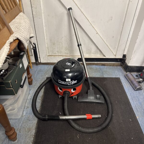 Red Numatic Henry Xtra cylinder vacuum cleaner for sale.