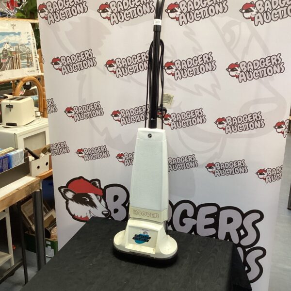 Vintage Hoover carpet shampooer in used condition, ideal for collectors.