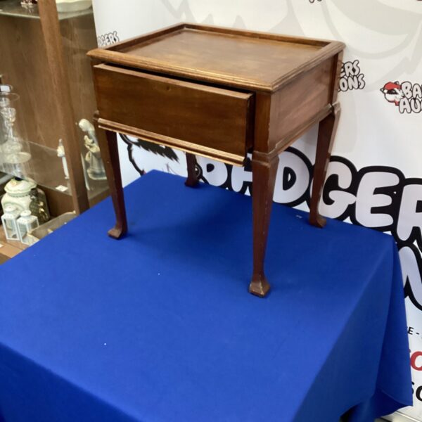 Vintage wooden occasional table with a single drawer.