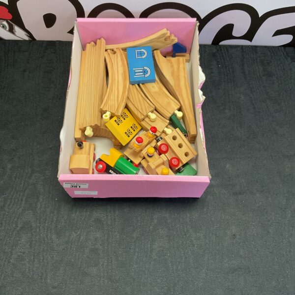 Vintage Brio wooden train set with tracks and carriages.
