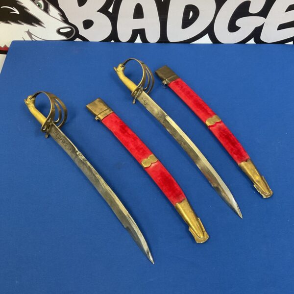 Antique pair of Indian ceremonial swords with curved blades.