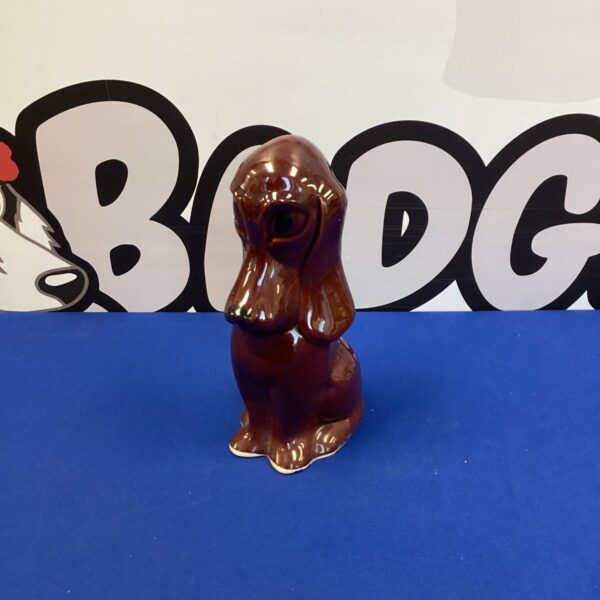 Vintage porcelain dog figurine, a charming collectible for home decor.