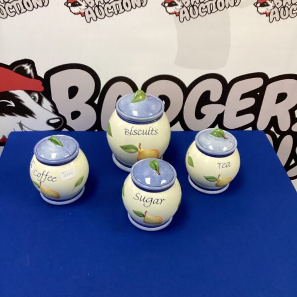 Set of three ceramic kitchen storage jars for pantry organisation.