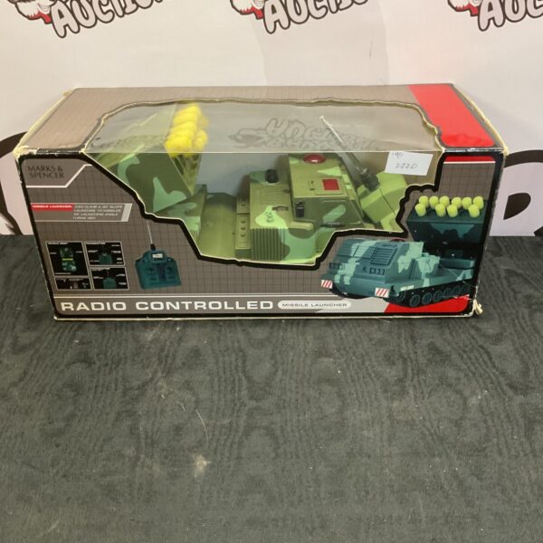 Vintage Marks and Spencer missile launcher toy in used condition.