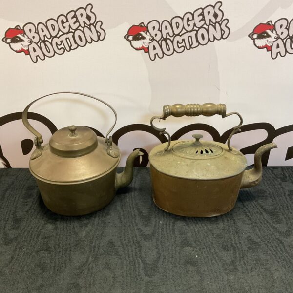 Antique copper kettles lot, vintage kitchenware collectible.