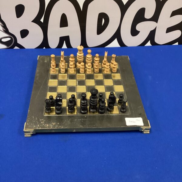 Vintage wooden chess set with folding board and pieces.