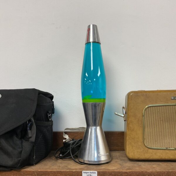 Vintage Mathmos Astro lava lamp with blue and green wax flow.
