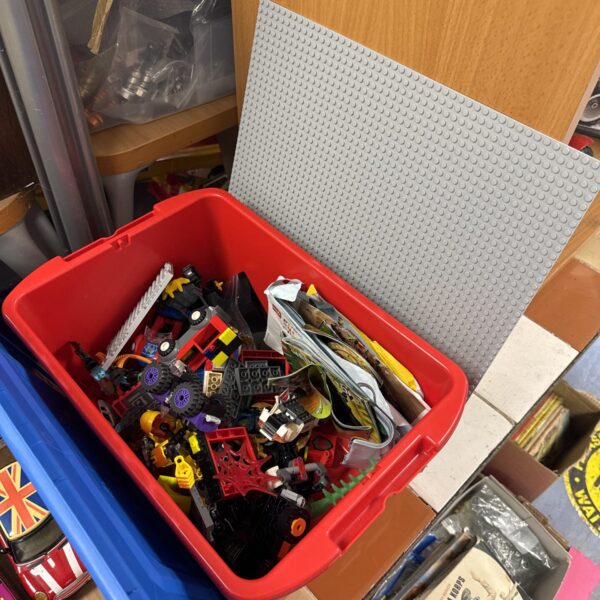 Large Lego mixed lot with building blocks and manuals.