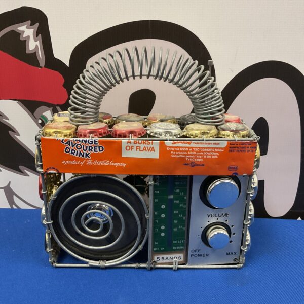 Handmade tin radio with Coca-Cola bottle caps.