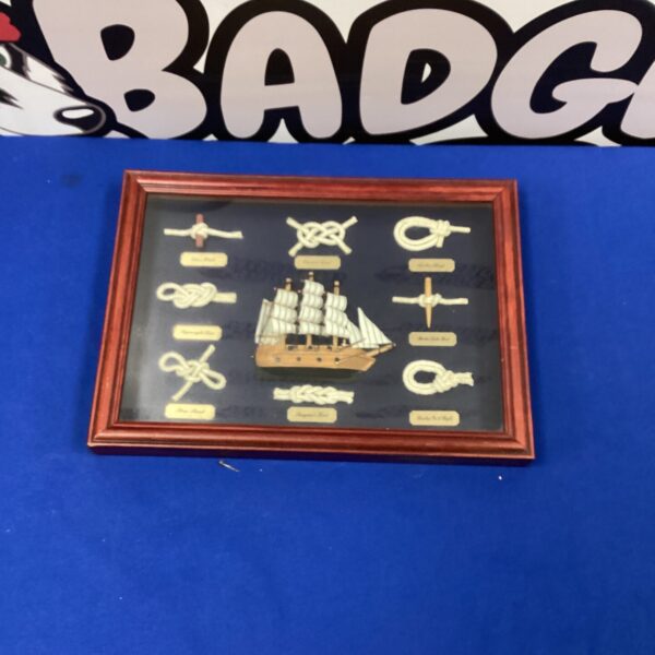 Vintage nautical knot shadow box with intricate sailor's knots.