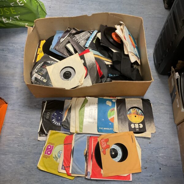 Vintage 7 inch vinyl records lot for collectors and music enthusiasts.