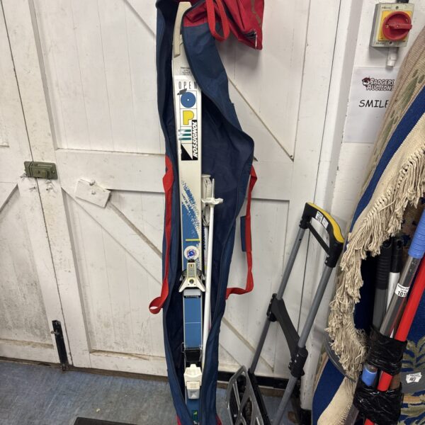 Rossignol Open XP33 skis and poles set for winter sports.