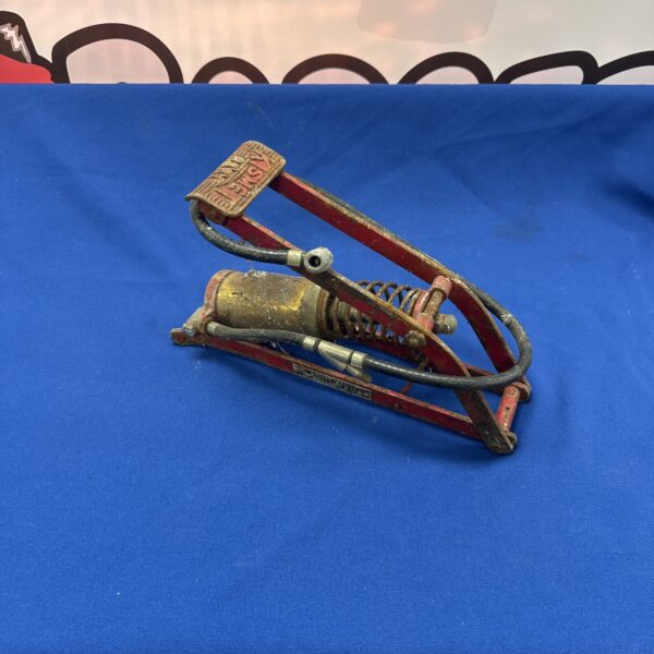 Vintage Kismet tyre inflator pump in red and brass.