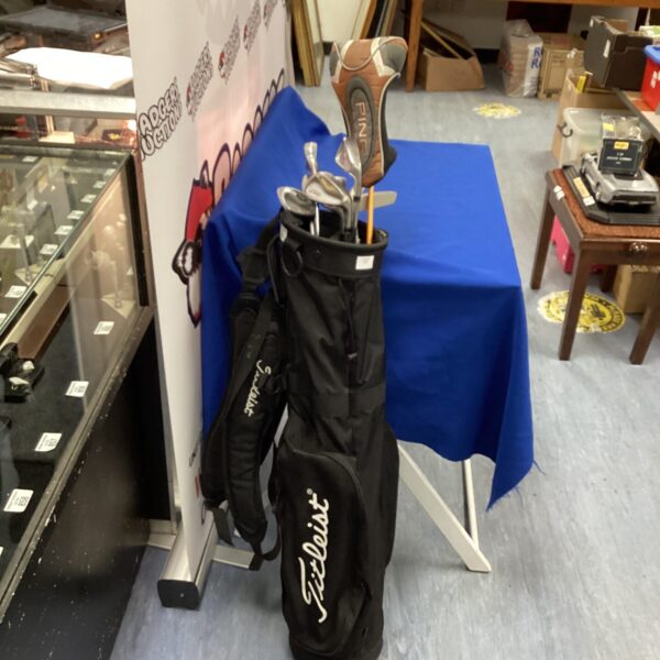 Titleist golf carry bag with Ping G10 driver and clubs.