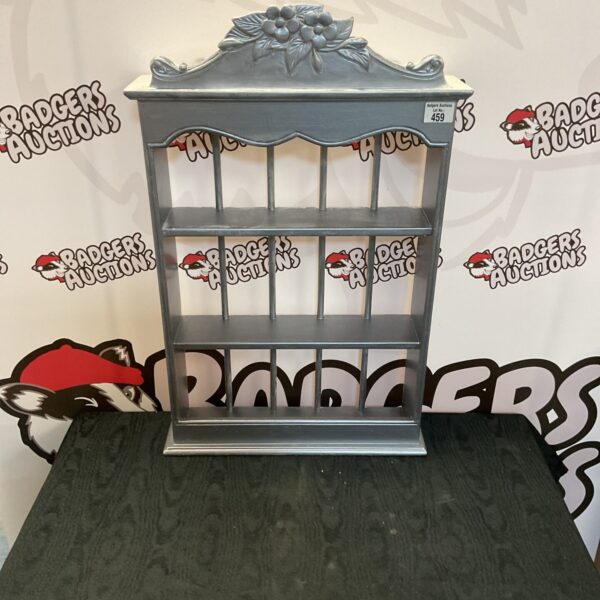 Vintage tiered collectors display shelves with decorative detailing.