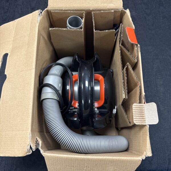 Black & Decker 12V car vacuum with flexible hose and attachments.