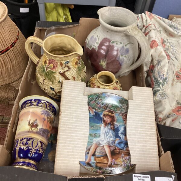 Mixed lot of decorative pottery jugs with colourful designs.