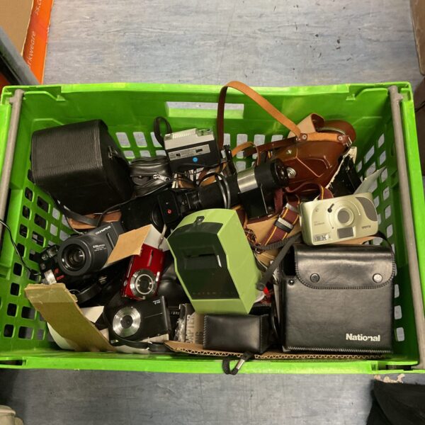 Vintage camera lot with various film cameras and accessories.
