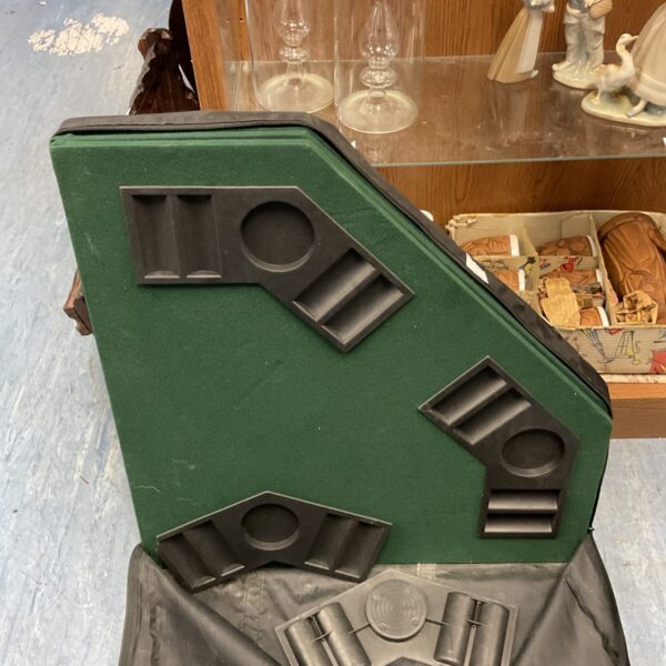 Green felt folding poker table for home game nights.