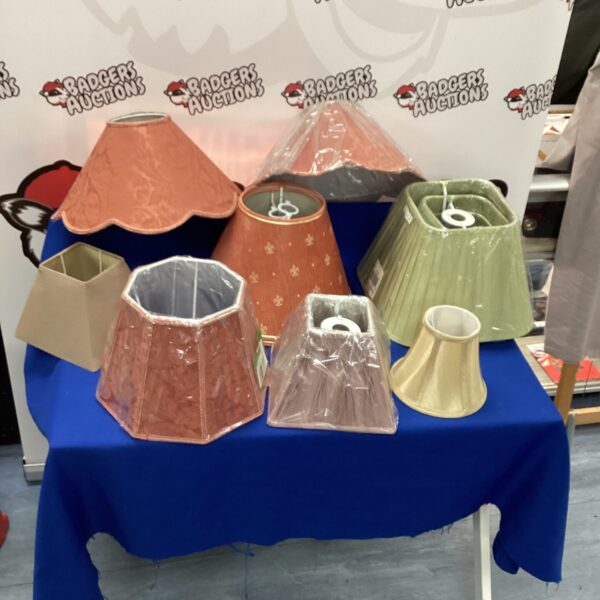 New lampshades in various colours and sizes for home lighting.