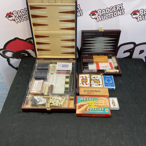 Vintage mixed board games and dominoes in a wooden box.