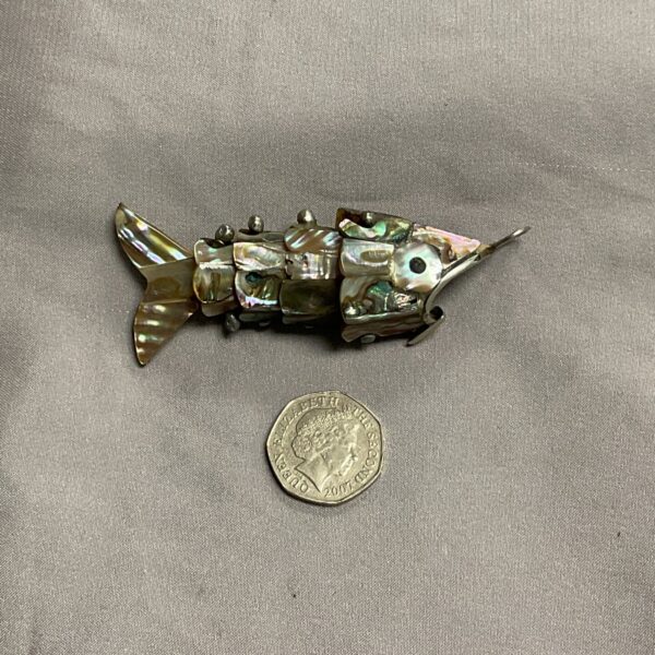 Vintage silver and abalone articulated fish pendant, iridescent shell.