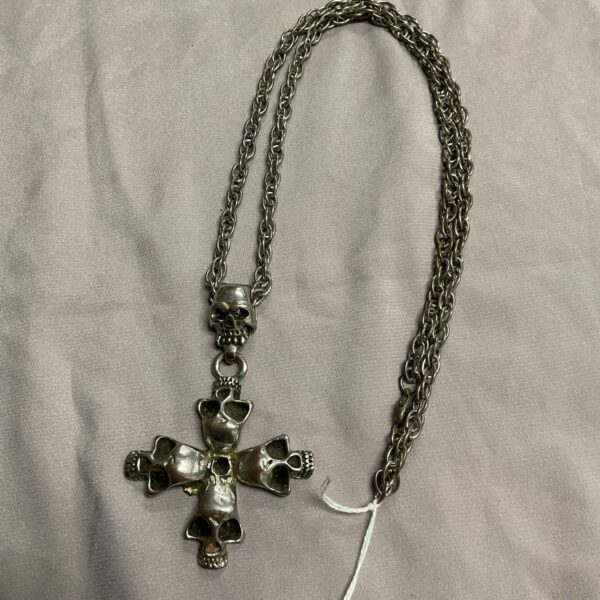 Vintage silver tone skull crucifix necklace on chain.