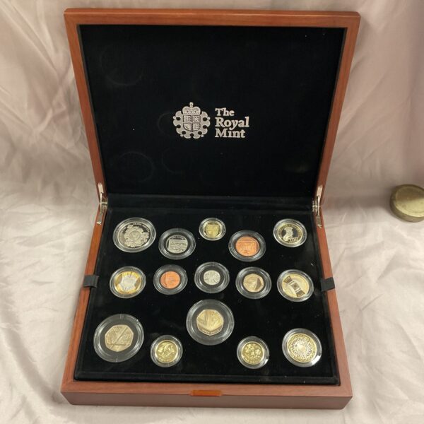 Open wooden case displaying the Royal Mint 2014 proof coin set.