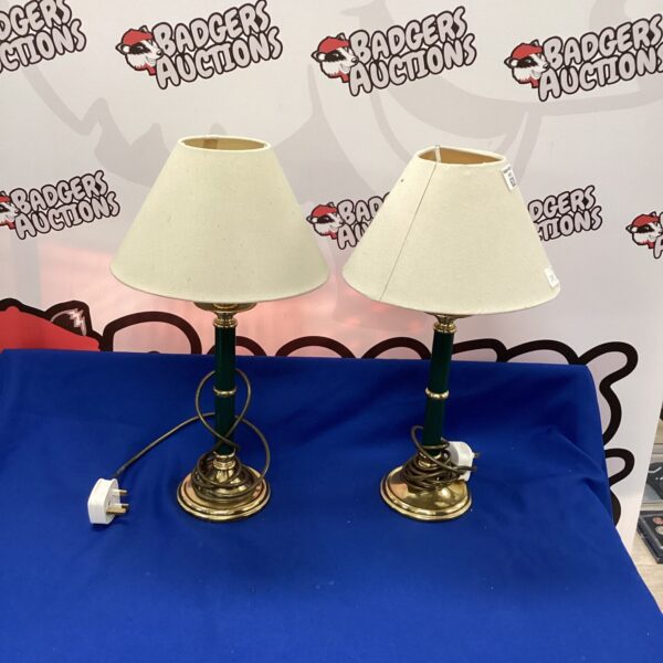 Pair of vintage brass table lamps with cream shades.