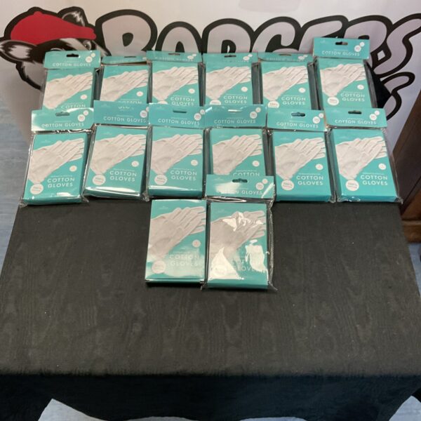 Box of new white dermatologist cotton gloves for hand care.