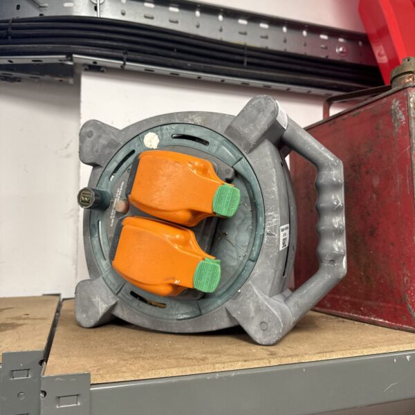 Used Masterplug extension reel for outdoor power access.