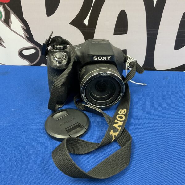 Sony DSC-H300 digital camera with strap, side view.